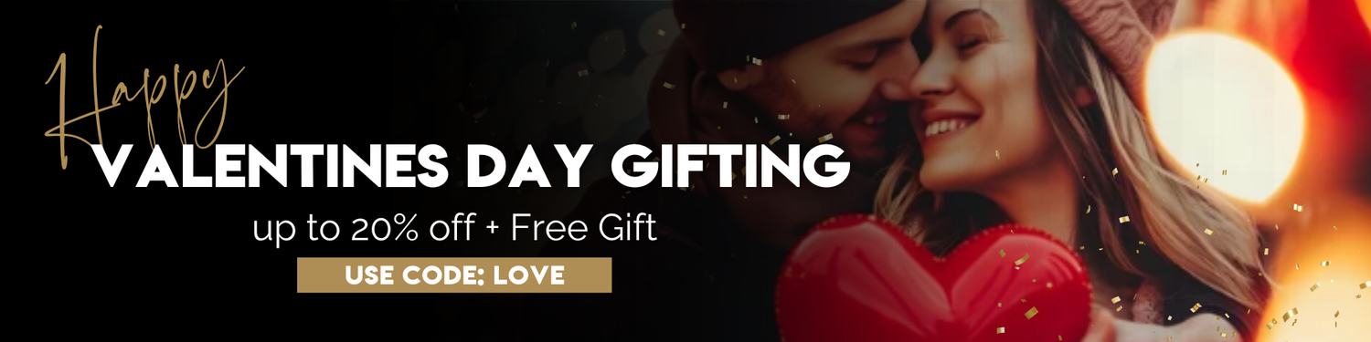 Valentine's Day promotional banner with a couple embracing and a heart-shaped gift, featuring text about discounts and a free gift offer.