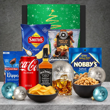 Jack Daniel’s Old No. 7 Christmas hamper with Coca-Cola, salted peanuts, chocolate-coated almonds and savoury chips.
Copy alt text