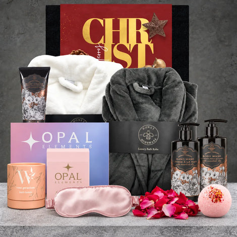 Luxury Christmas self-care hamper with bath and body products, bath salts, a silky eye mask and a soft white bathrobe