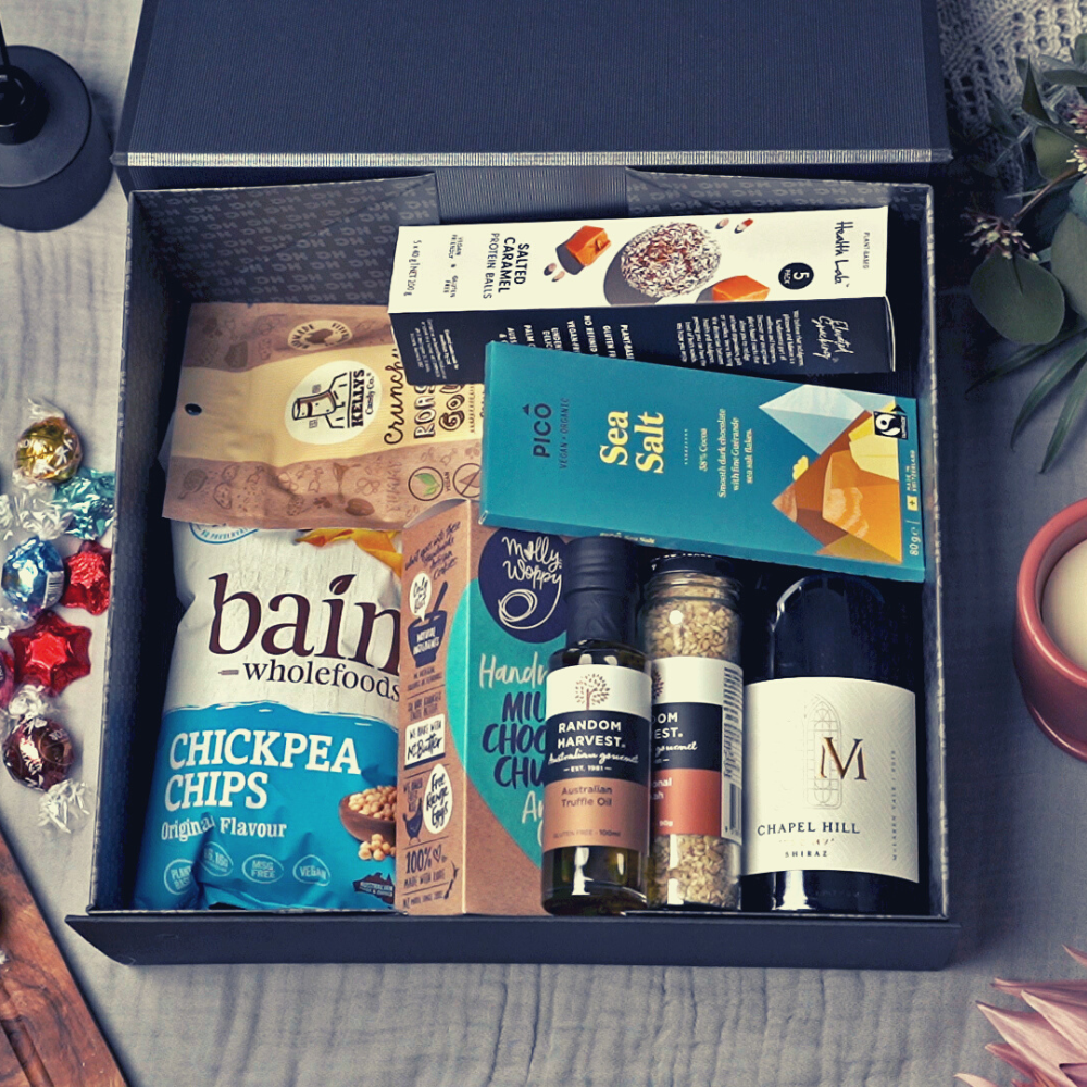 Christmas gift hamper box containing a selection of gourmet treats