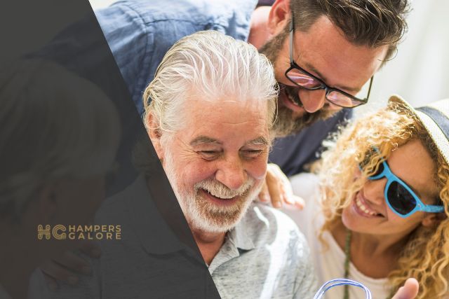 2 men and a woman smiling at each other
