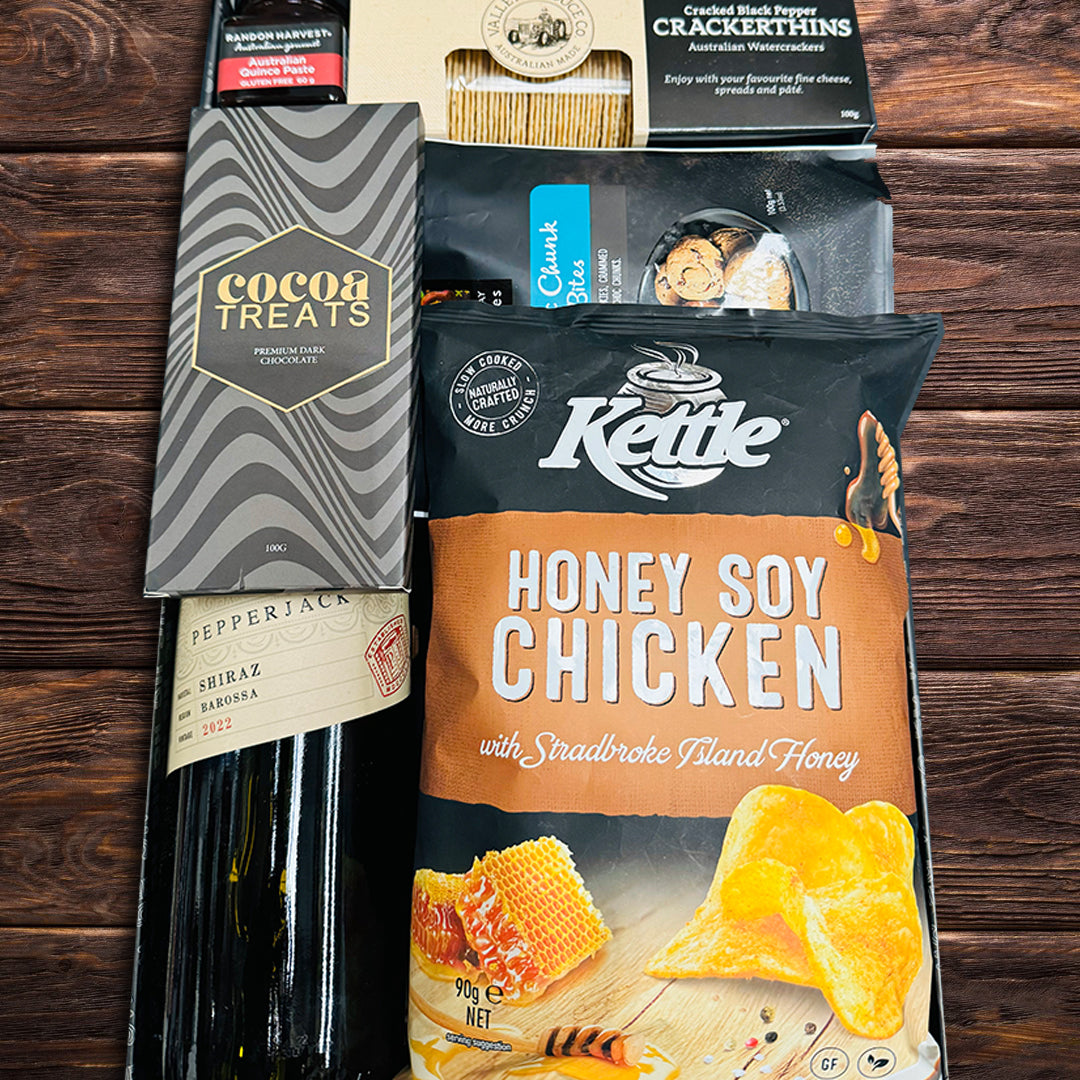 Cocoa Treats dark chocolate,Byron Bay cookie pouch,Valley produce black paper crackerthing,Kettle chickenchips,Australian Quince paste hamper
