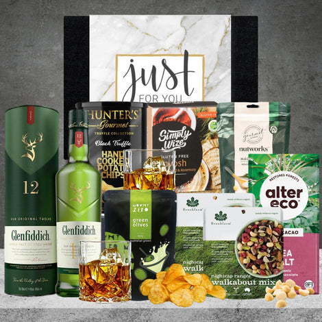 A Vegan Whiskey Delight gift hamper featuring whiskey and chocolates