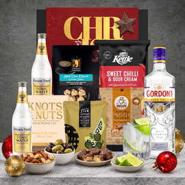Christmas gin hamper for her featuring Gordon's London Dry Gin, Fever-Tree tonic water, sweet chilli chips, roasted peanuts, lemon and thyme olives, and chocolate treats