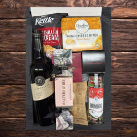 Christmas pudding and wine gift for festive celebrations