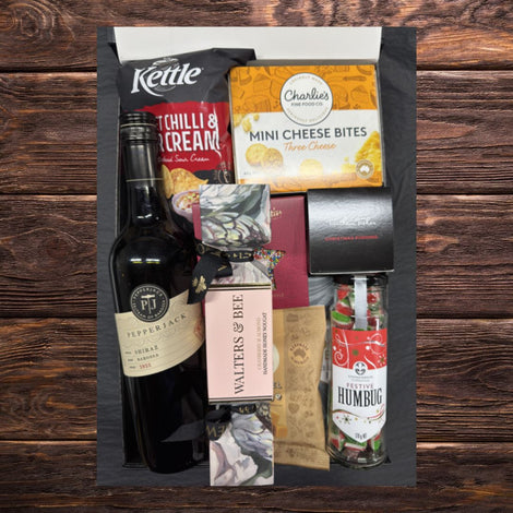 Christmas pudding and wine gift for festive celebrations
