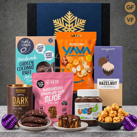 Christmas vegan hot chocolate hamper with dark drinking chocolate, hazelnut spread, organic chocolate, cookies and caramel cashew popcorn.