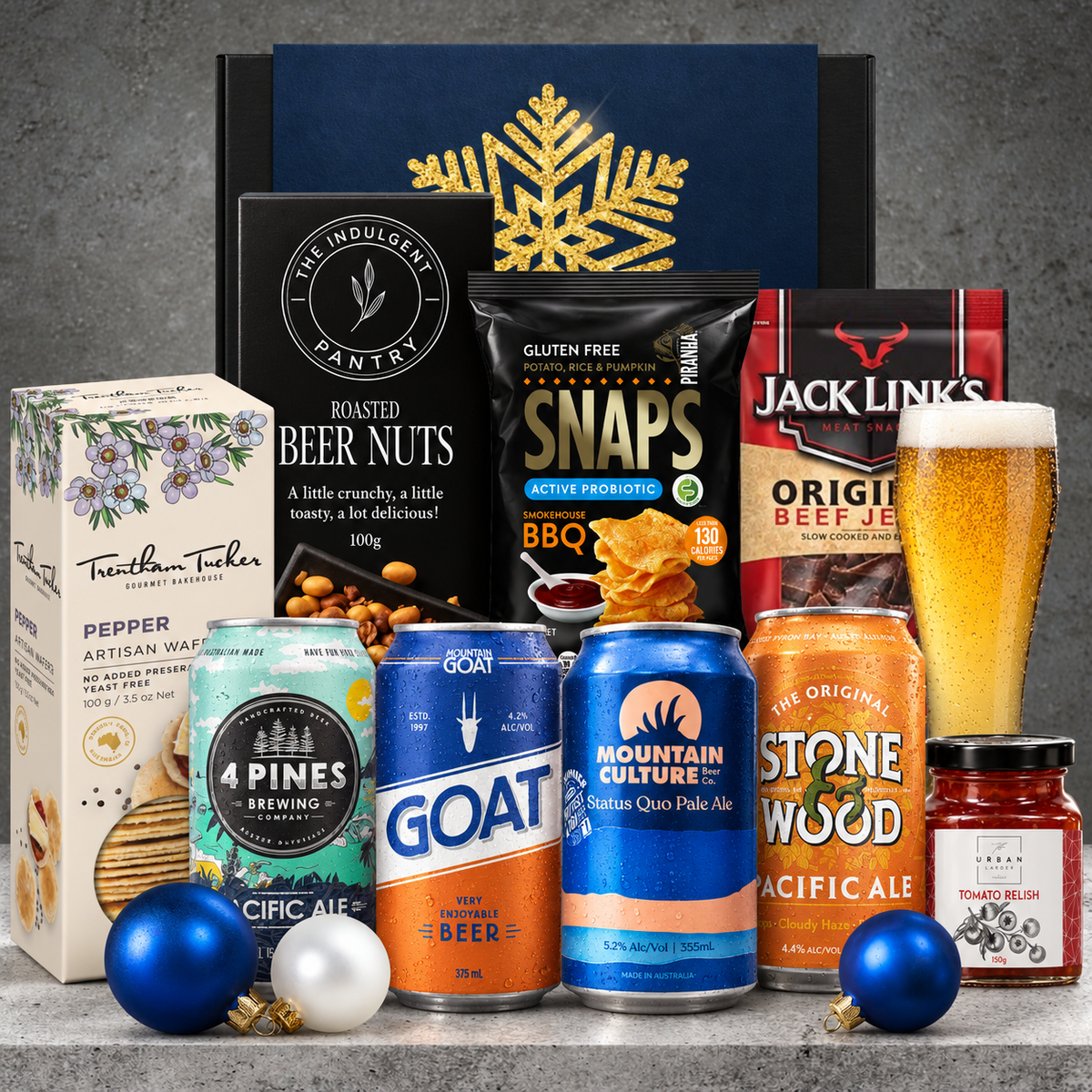 Craft beer Christmas hamper for him featuring four Australian beers, beef jerky, BBQ snaps, beer nuts, pepper wafers and tomato relish