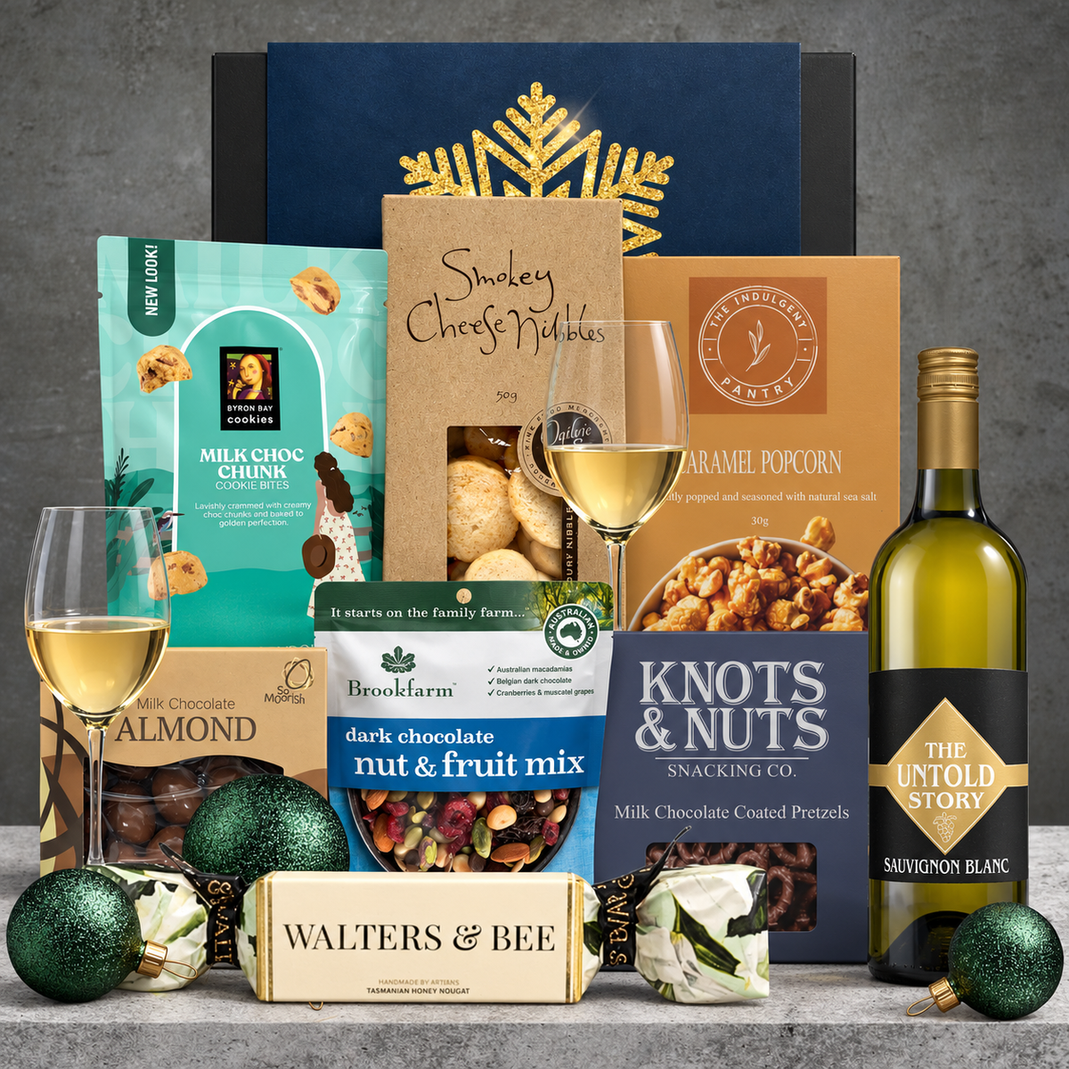 Hampers Galore White Wine Christmas Hamper featuring The Untold Story Sauvignon Blanc, chocolate almonds, pretzels and gourmet snacks.