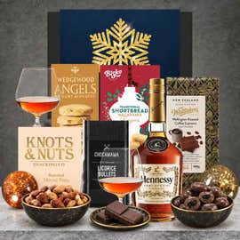 Hennessy Cognac Christmas hamper featuring a 700ml bottle of Hennessy VS Cognac, roasted mixed nuts, nougat biscuits, dark chocolate liquorice, coffee chocolate and Christmas shortbread