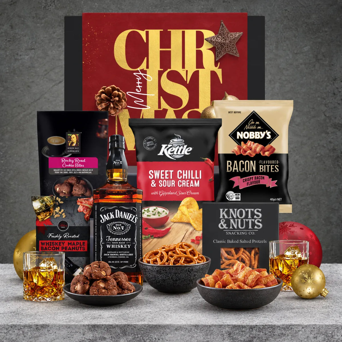 Jack Daniel's Old No. 7 Tennessee Whiskey Christmas hamper with baked pretzels, maple bacon peanuts, sweet chilli chips, bacon bites and rocky road cookies