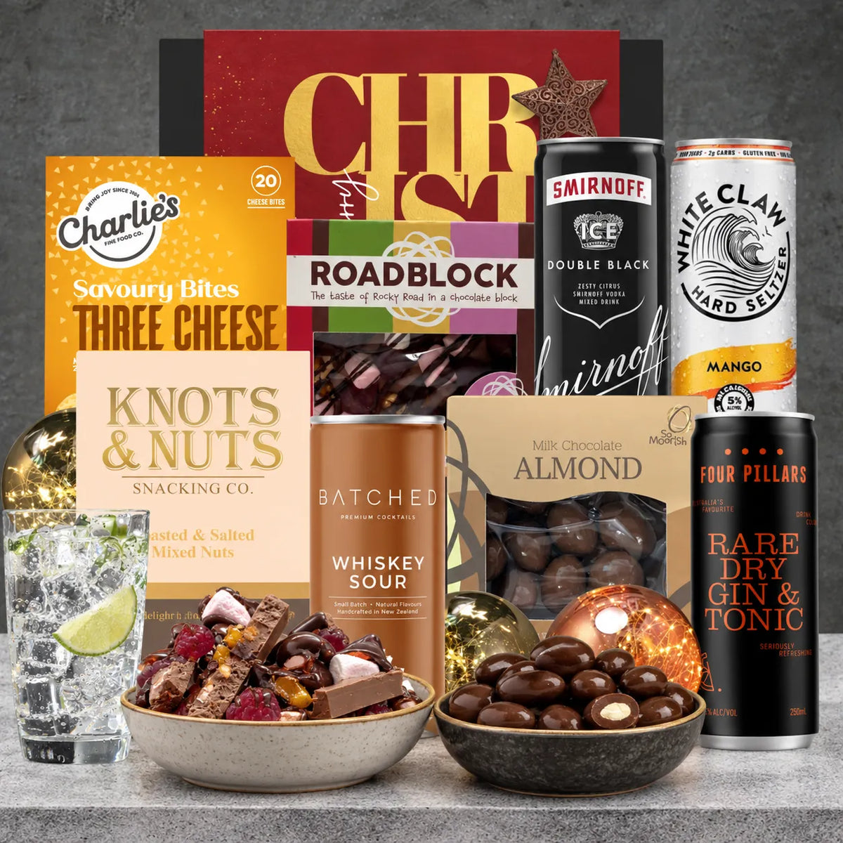 Mix It Up Spirits Christmas hamper featuring gin and tonic, whiskey sour, Smirnoff Double Black Ice, White Claw Mango and assorted snacks