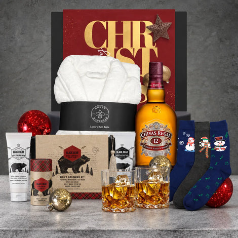 Premium men's Christmas hamper with Scotch whisky, a comfortable bath robe, three pairs of Christmas socks and a grooming gift set.
