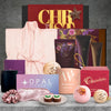 Rejuvenating Christmas self-care hamper featuring a satin bathrobe, fig and lavender body pamper set, bath bomb, silky eye mask, plum soy candle and Christmas chocolate