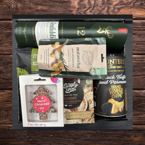 Vegan Christmas whiskey gift hamper with premium whiskey and festive gourmet treats